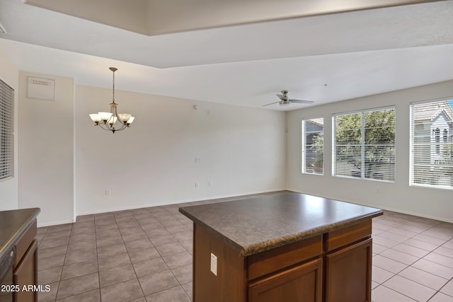 280 S Evergreen Rd Unit 1296, Tempe, AZ 85288 - kitchen featuring dark countertops, light tile patterned floors, healthy amount of natural light, and open floor plan