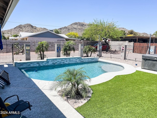 view of swimming pool with a fenced in pool, a mountain view, and fence