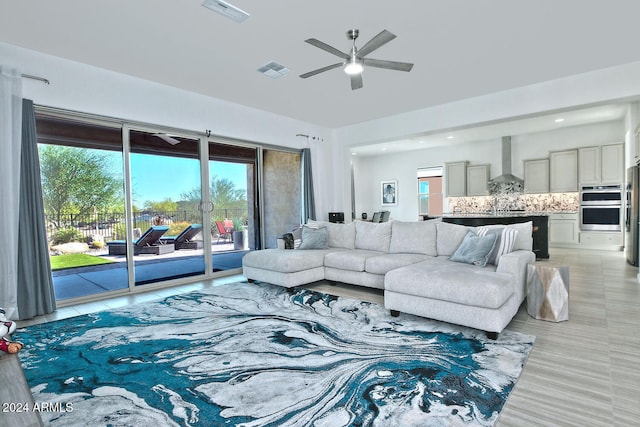 living room featuring ceiling fan