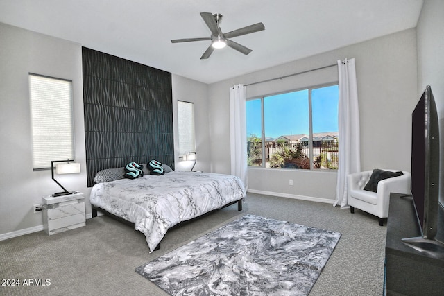 bedroom with ceiling fan and carpet flooring