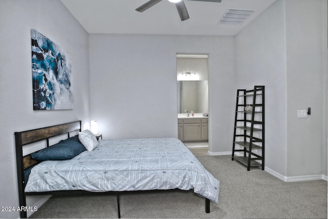 carpeted bedroom featuring connected bathroom, ceiling fan, and sink