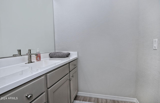 bathroom featuring vanity and hardwood / wood-style floors