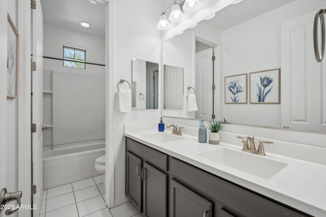 22341 N 100th Ln, Peoria, AZ 85383 - bathroom featuring double vanity, toilet, tile patterned floors, and washtub / shower combination