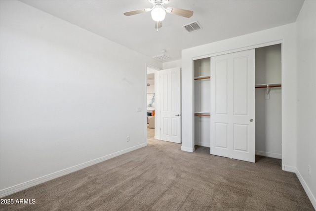 22341 N 100th Ln, Peoria, AZ 85383 - unfurnished bedroom featuring carpet, baseboards, a closet, and ceiling fan
