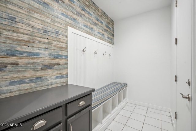 22341 N 100th Ln, Peoria, AZ 85383 - mudroom featuring wooden walls, an accent wall, light tile patterned floors, and baseboards