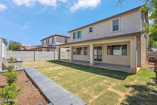 22341 N 100th Ln, Peoria, AZ 85383 - rear view of house with central AC unit, stucco siding, and a patio area