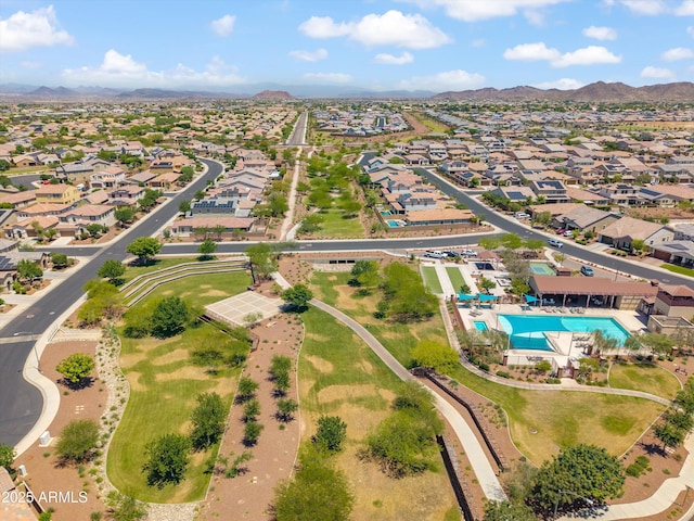 22341 N 100th Ln, Peoria, AZ 85383 - aerial overview of property's location with mountains, nearby suburban area, and a pool area