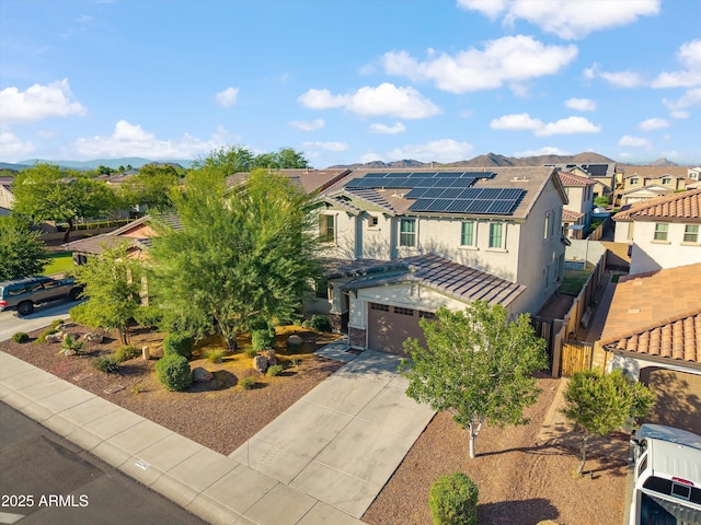22341 N 100th Ln, Peoria, AZ 85383 - view of front of property with a residential view, driveway, stucco siding, and an attached garage