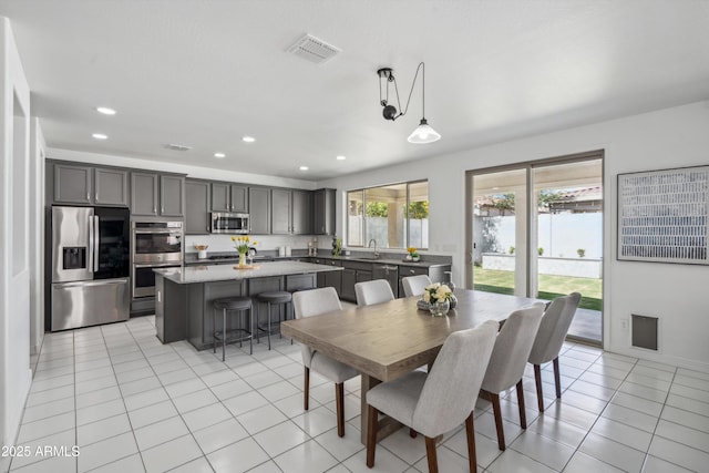 22341 N 100th Ln, Peoria, AZ 85383 - dining area featuring light tile patterned floors and recessed lighting