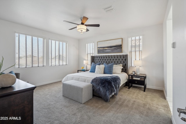 22341 N 100th Ln, Peoria, AZ 85383 - carpeted bedroom with multiple windows, baseboards, and a ceiling fan