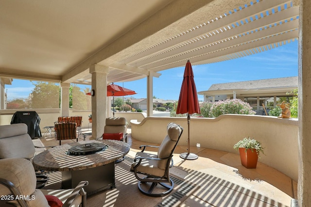 view of patio / terrace featuring an outdoor fire pit and a pergola