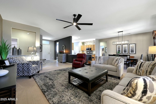 living room with light carpet and a ceiling fan