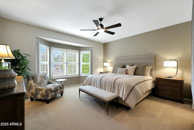 bedroom featuring a ceiling fan and light colored carpet