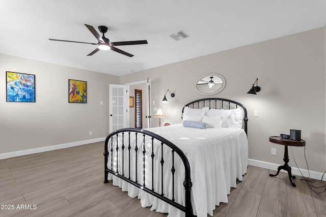 bedroom with ceiling fan and light hardwood / wood-style floors