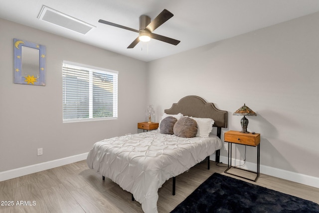 bedroom with ceiling fan and light hardwood / wood-style flooring