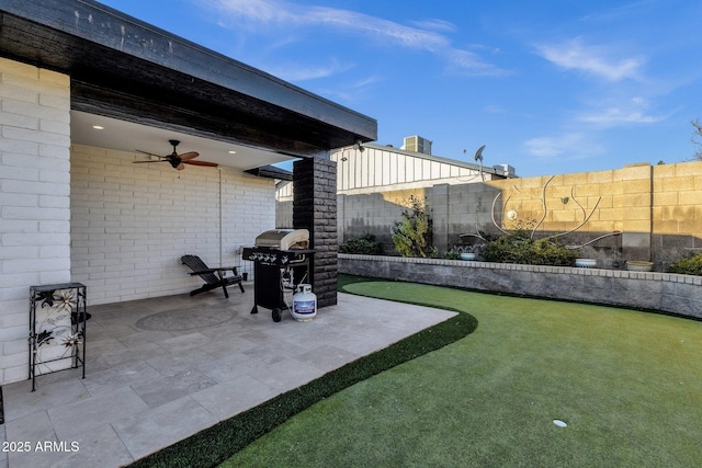 view of yard featuring ceiling fan, central AC, and a patio area