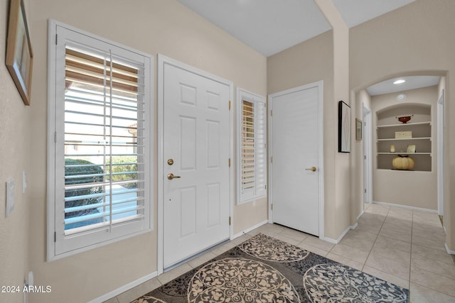 foyer with light tile patterned flooring