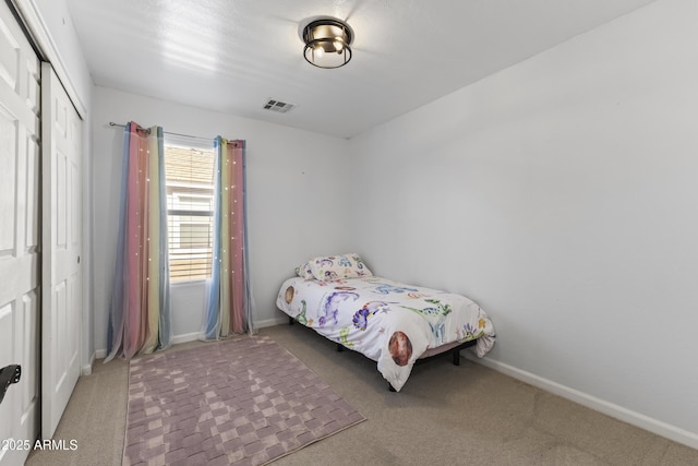 carpeted bedroom featuring a closet