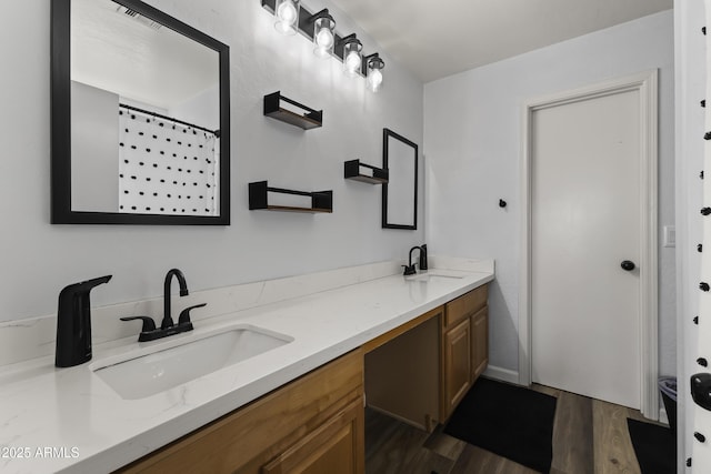 bathroom featuring vanity, hardwood / wood-style floors, and curtained shower