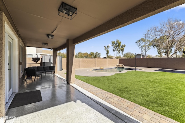 view of patio / terrace with a fenced in pool and an outdoor hangout area