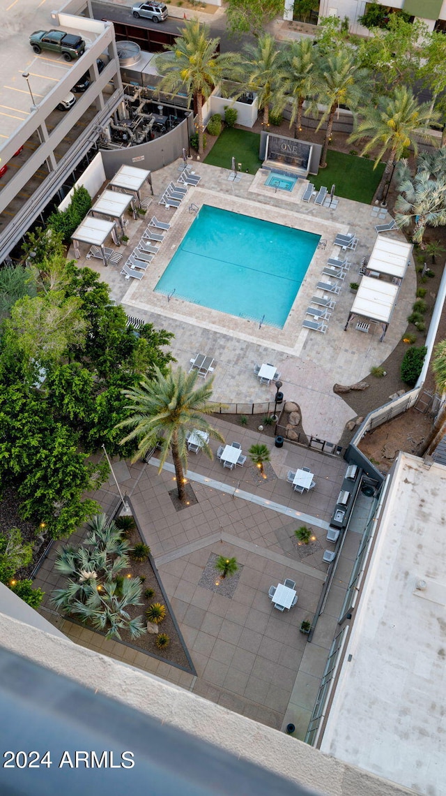 view of swimming pool featuring a patio area