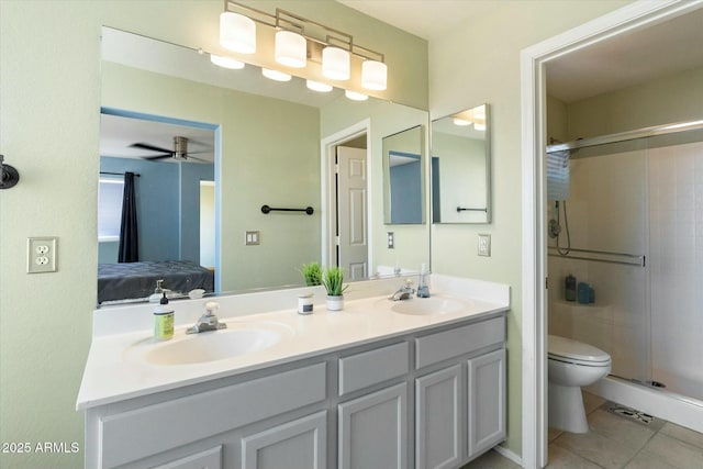 ensuite bathroom featuring a sink, a shower stall, ensuite bath, and double vanity