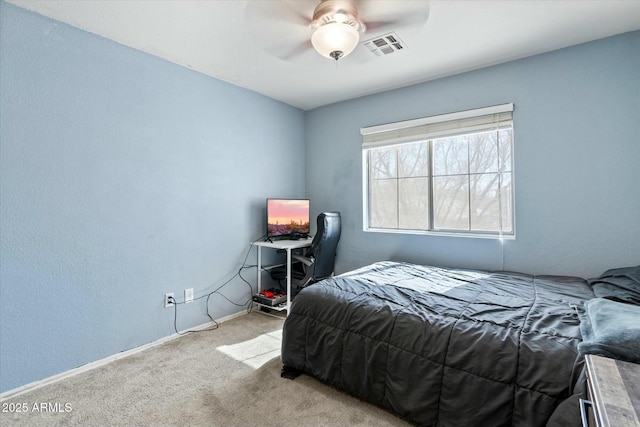 bedroom with carpet flooring, ceiling fan, baseboards, and visible vents