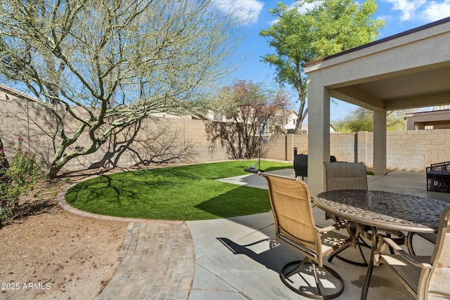 view of patio / terrace featuring a fenced backyard and outdoor dining space