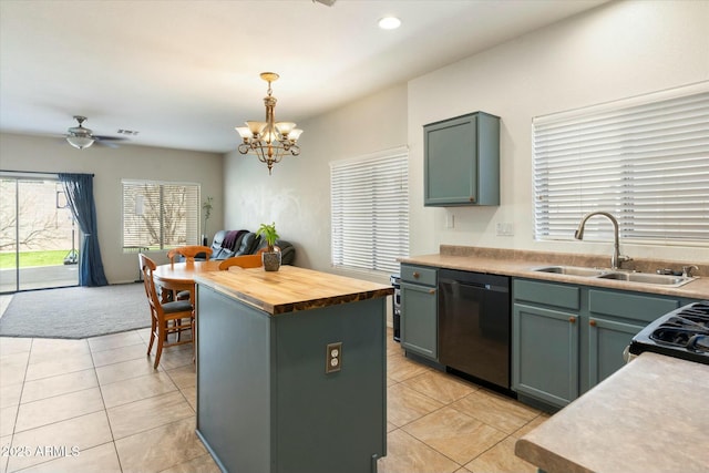 kitchen featuring a sink, a center island, light tile patterned floors, wooden counters, and dishwasher