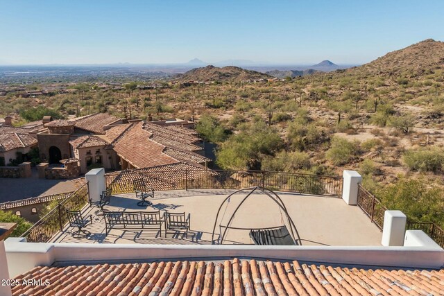 view of patio / terrace featuring a mountain view