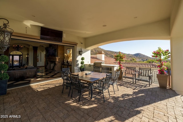 view of patio with a grill