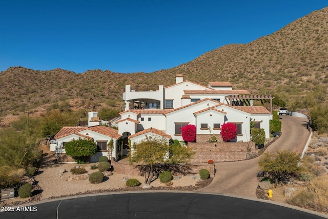 view of front of home featuring a mountain view