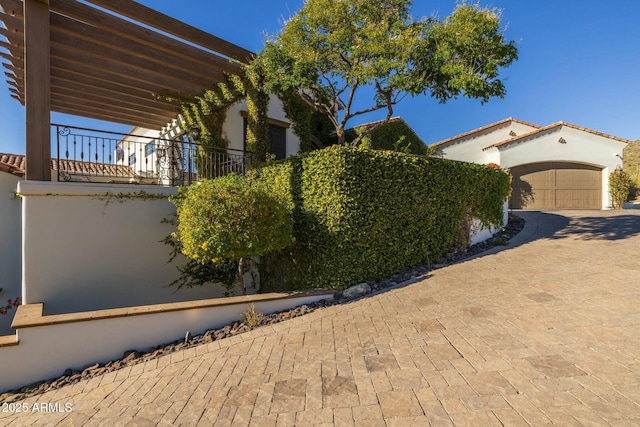 view of property exterior featuring a garage