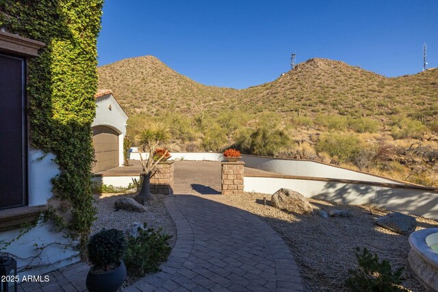 view of patio / terrace featuring a mountain view