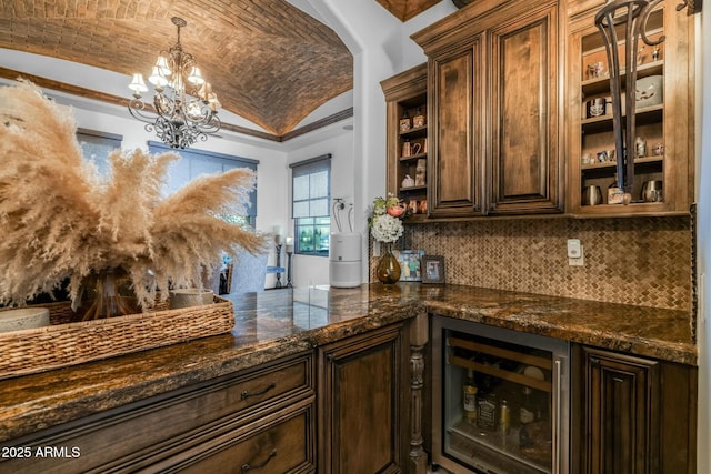 bar with brick ceiling, dark brown cabinets, vaulted ceiling, beverage cooler, and pendant lighting