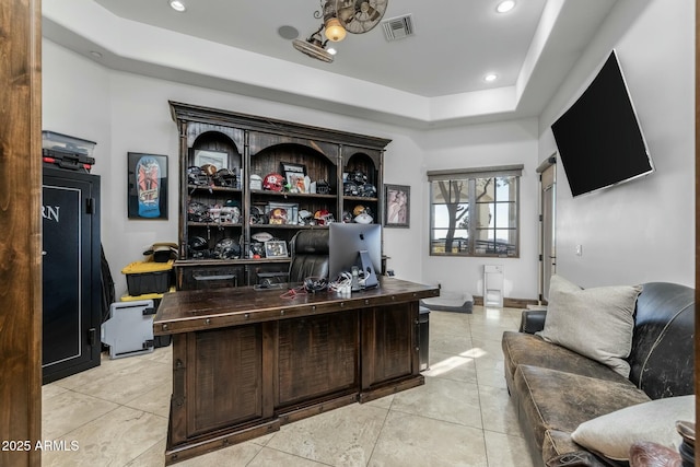 tiled office featuring a raised ceiling