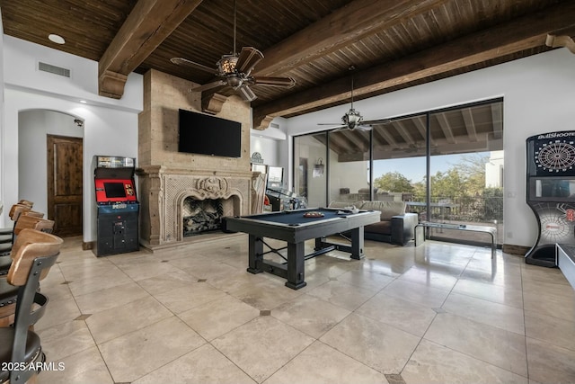 playroom with a high end fireplace, beam ceiling, pool table, and wood ceiling