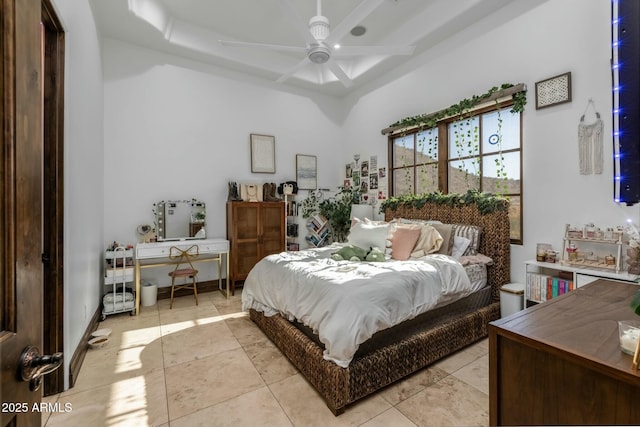 tiled bedroom with ceiling fan