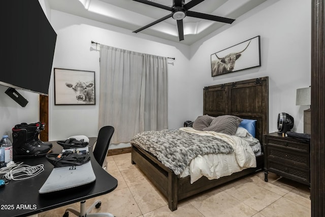 tiled bedroom featuring ceiling fan and a raised ceiling