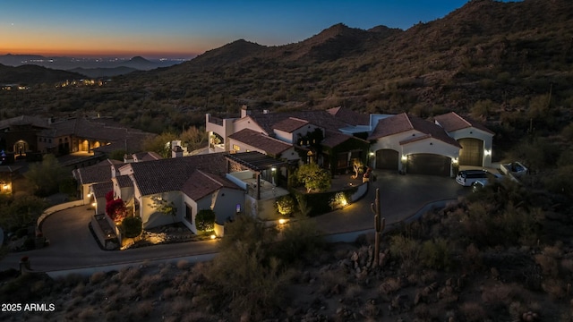 aerial view at dusk with a mountain view