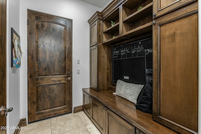 mudroom with light tile patterned floors