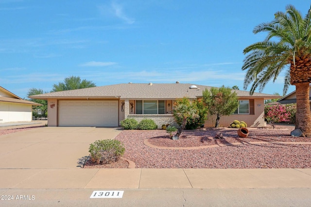 single story home with a garage