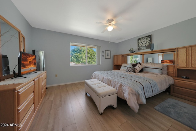 bedroom featuring light wood-type flooring and ceiling fan