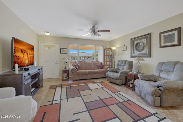 tiled living room with ceiling fan