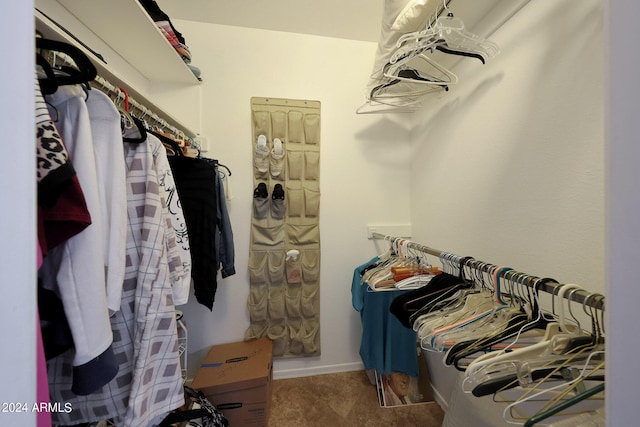 spacious closet featuring carpet floors