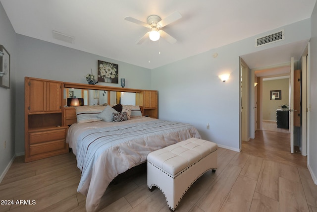 bedroom with light wood-type flooring and ceiling fan