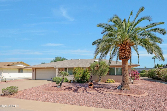 ranch-style home featuring a garage