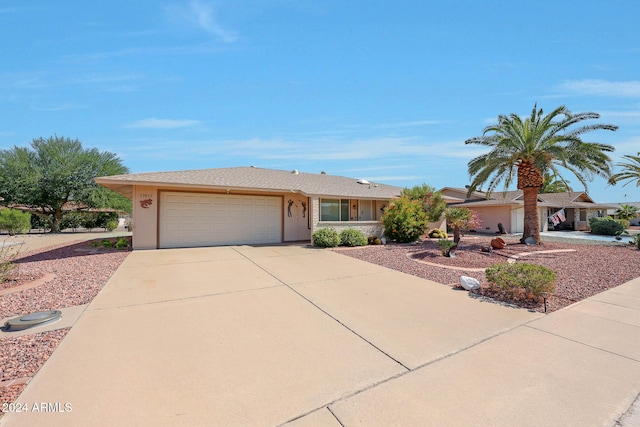 ranch-style home with a garage