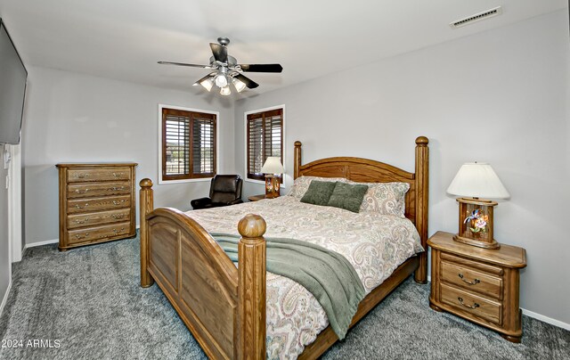 bedroom with ceiling fan and carpet floors