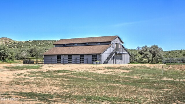 view of home's exterior with an outbuilding